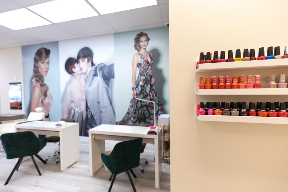 Manicure area with polished tables and chairs